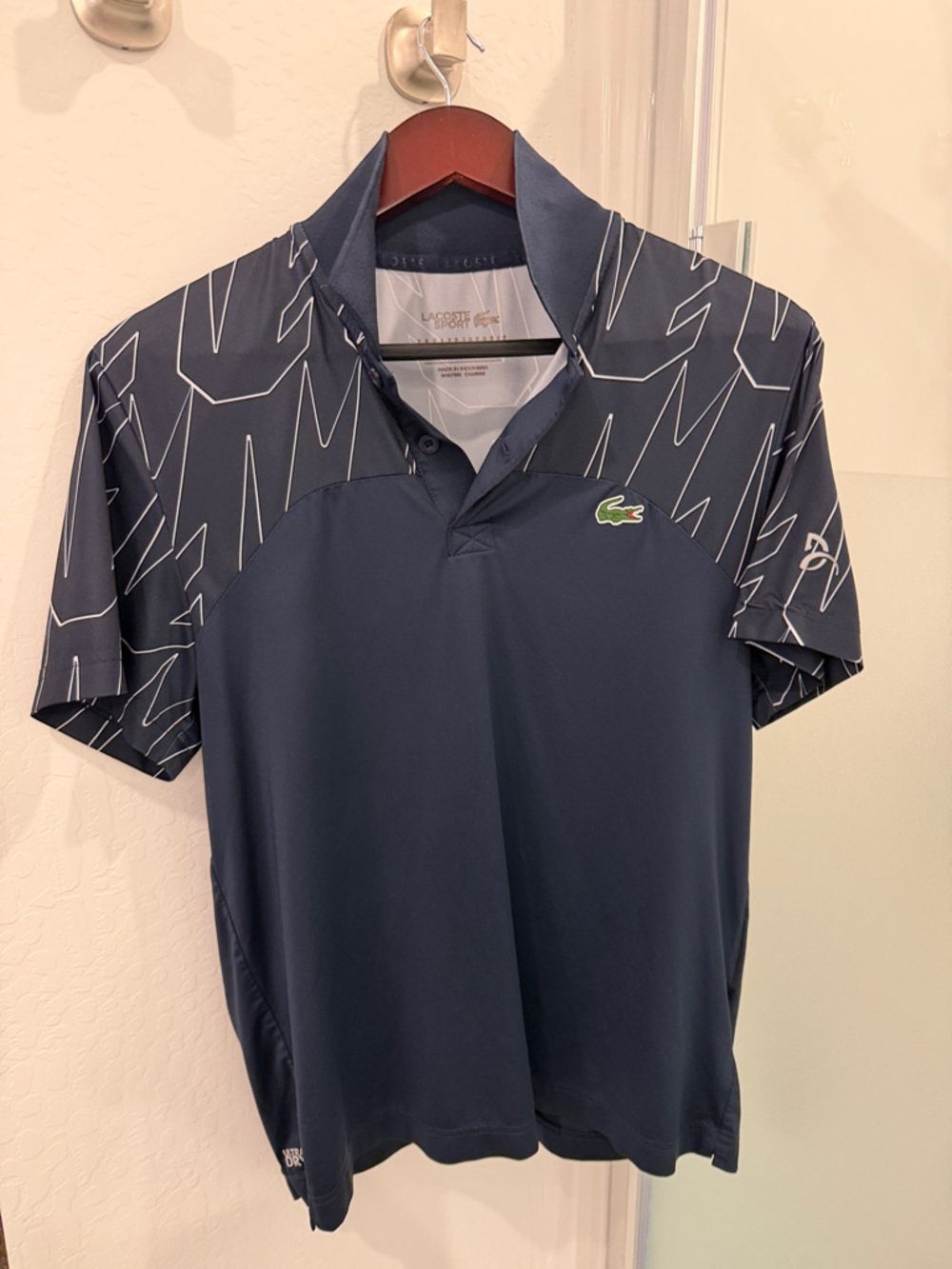 Lacoste Navy Polo with White Sleeve Pattern